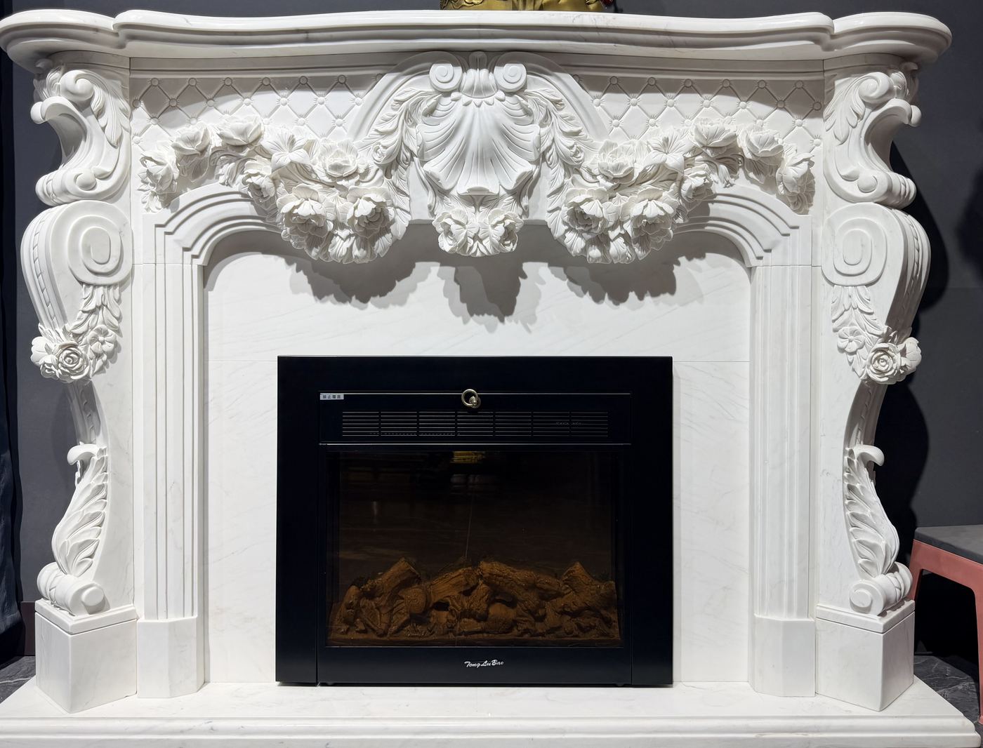 White marble fireplace carving